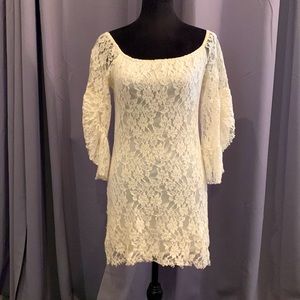 Romantic little white lace dress fully lined. No tags. Probably a medium.